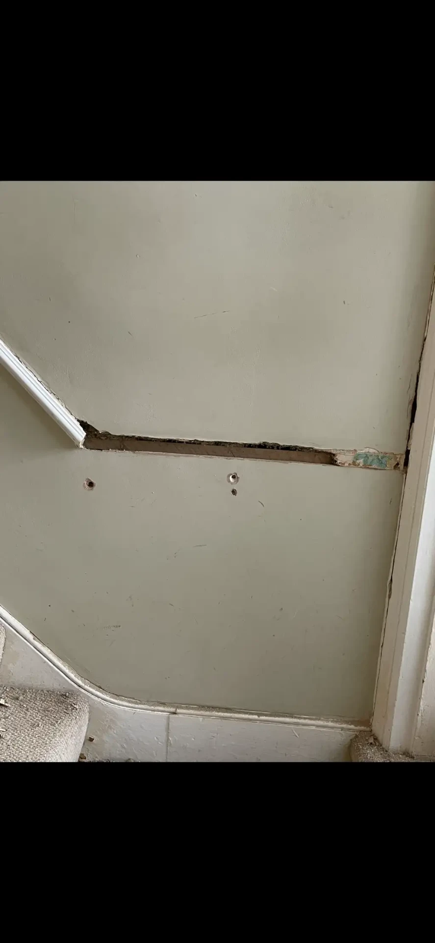 Before — Staircase wall made good after dado removal, Hallway & stairs · Teddington